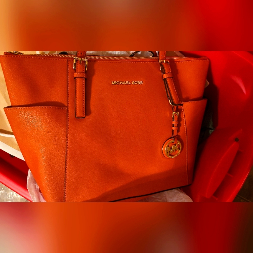 Orange Michael Kors purse with matching wallet